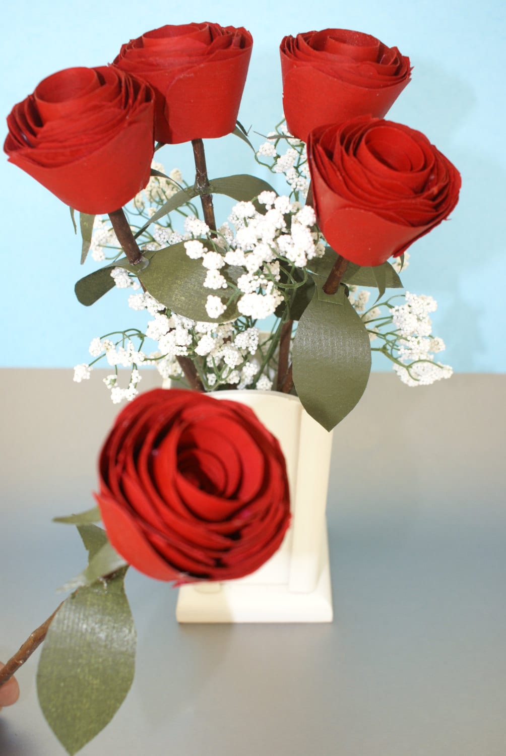 5 Red wood roses on real branch in white wood vase