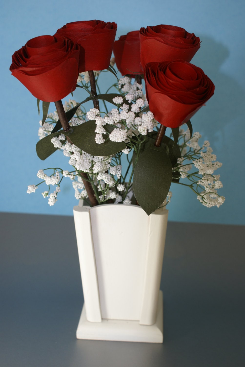 5 Red wood roses on real branch in white wood vase