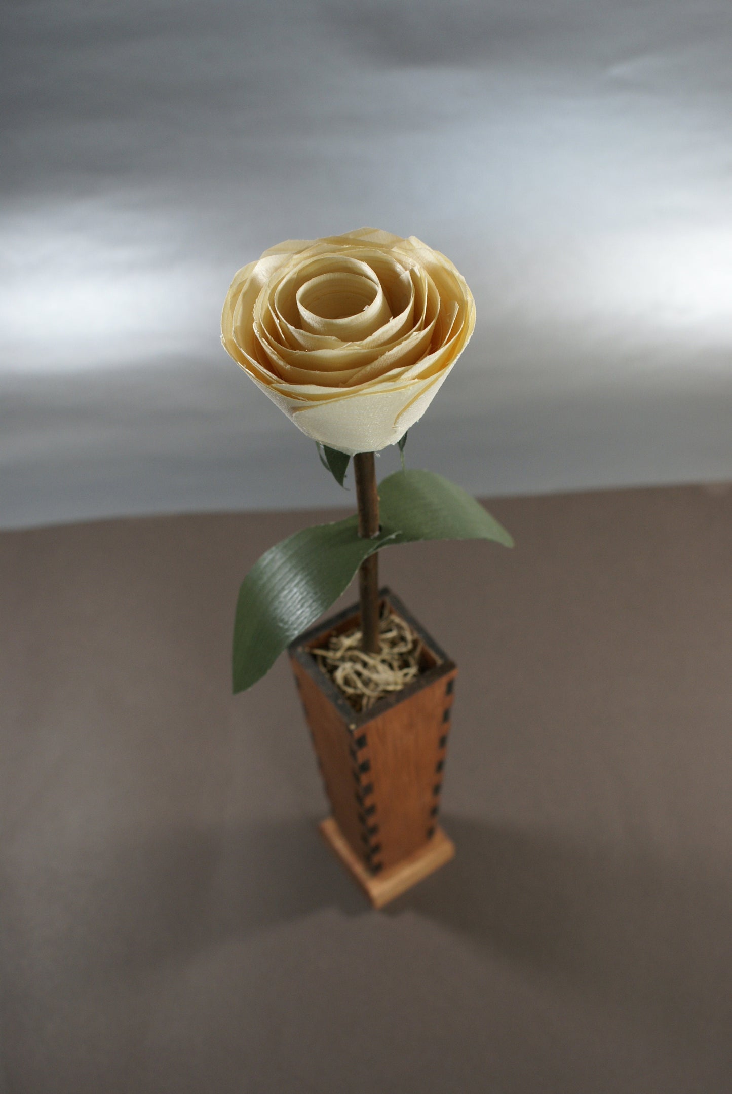 Wood rose and wooden vase