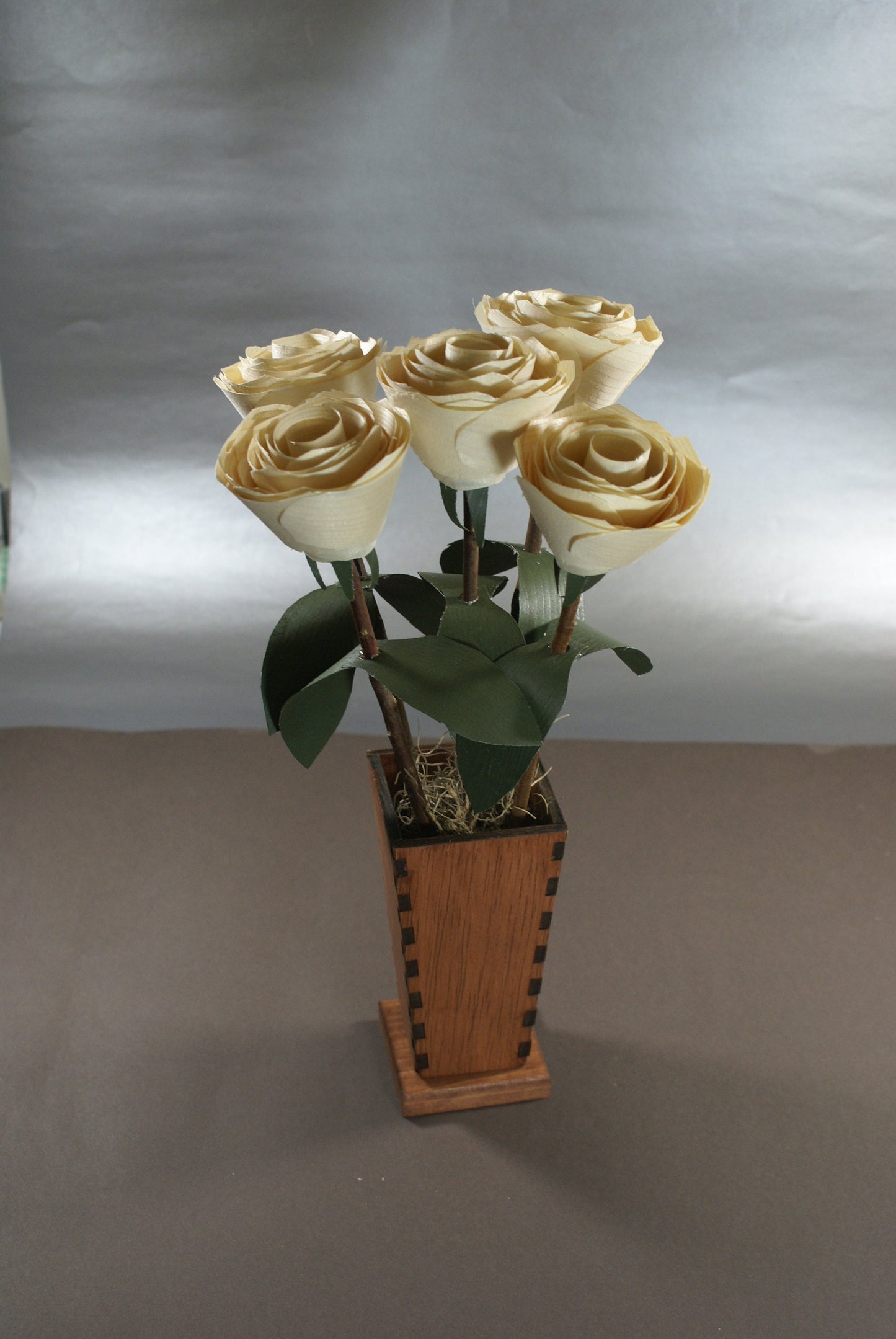 5 Wooden roses in wood vase