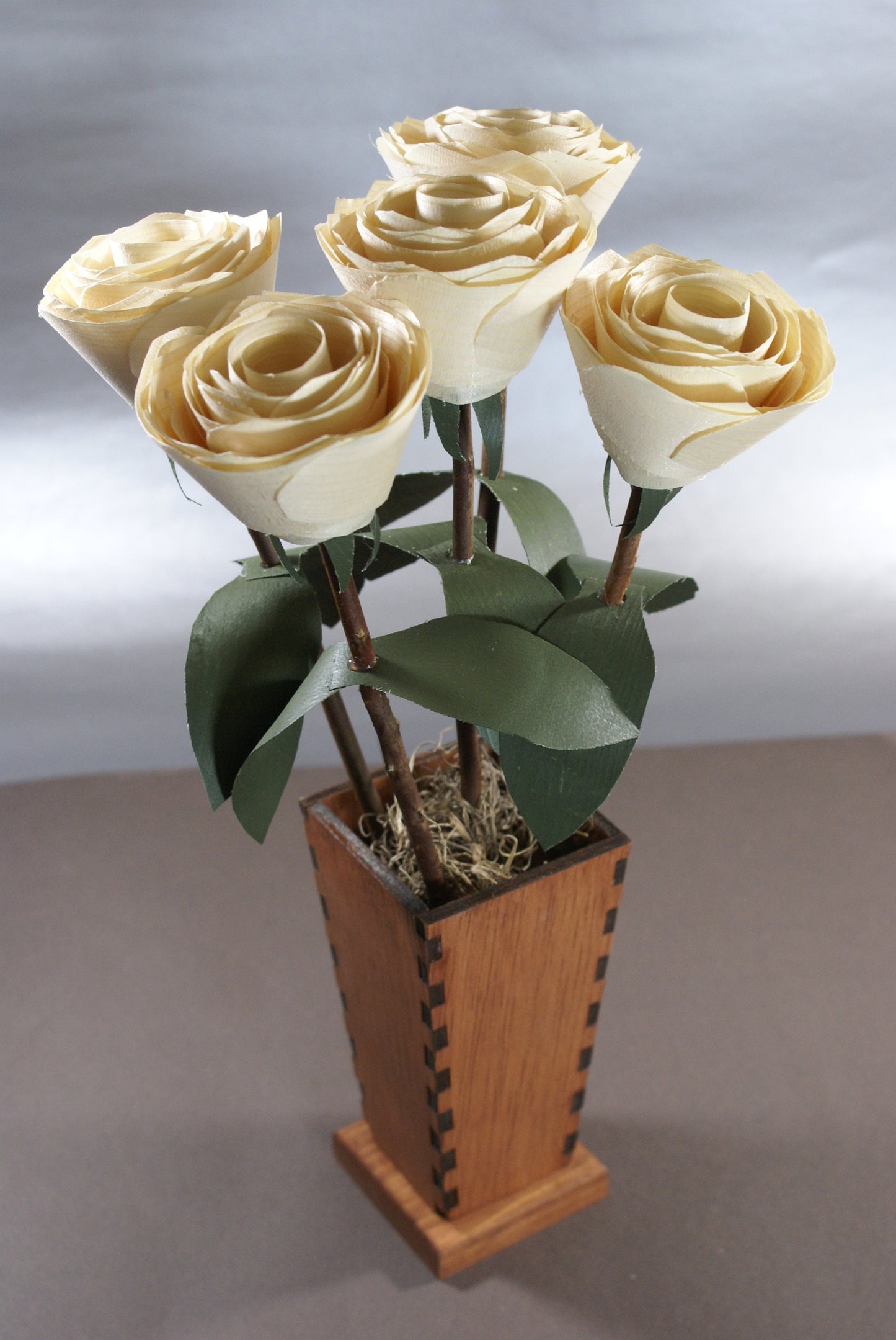 5 Wooden roses in wood vase