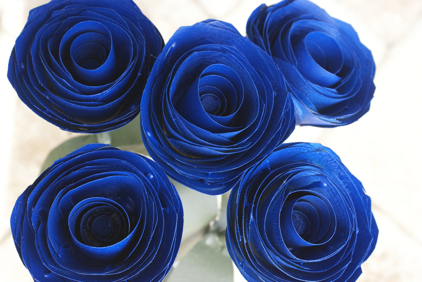 5 Blue wood roses in white vase, blue and white,