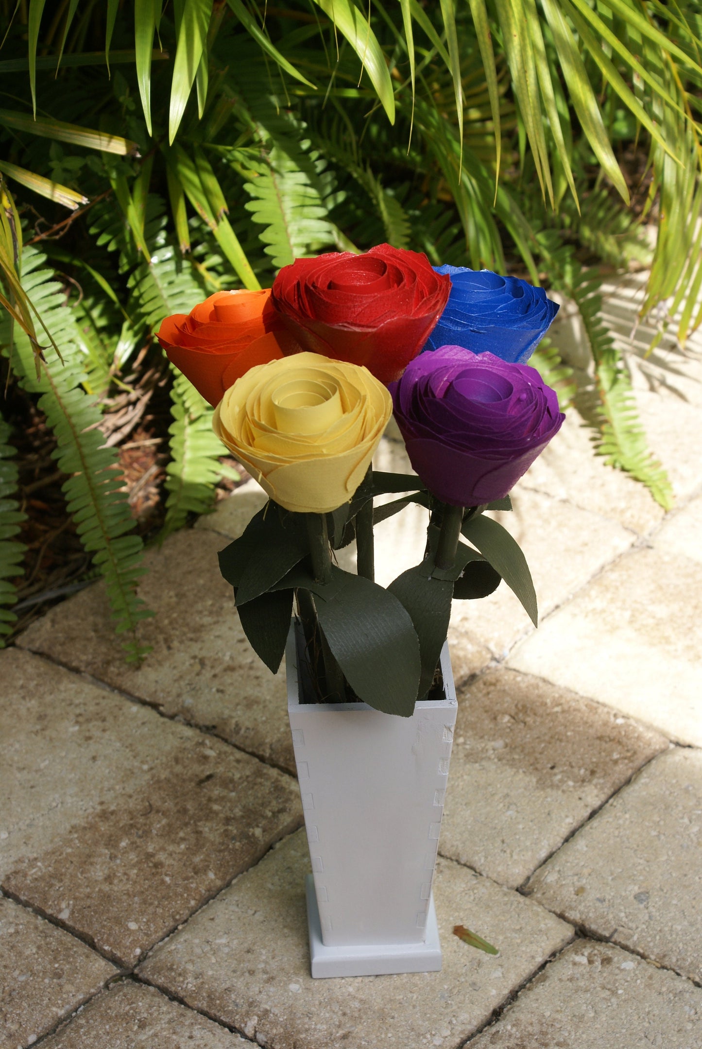 5 Rainbow color wood roses in white vase, Red, orange yellow blue and purple on green stems