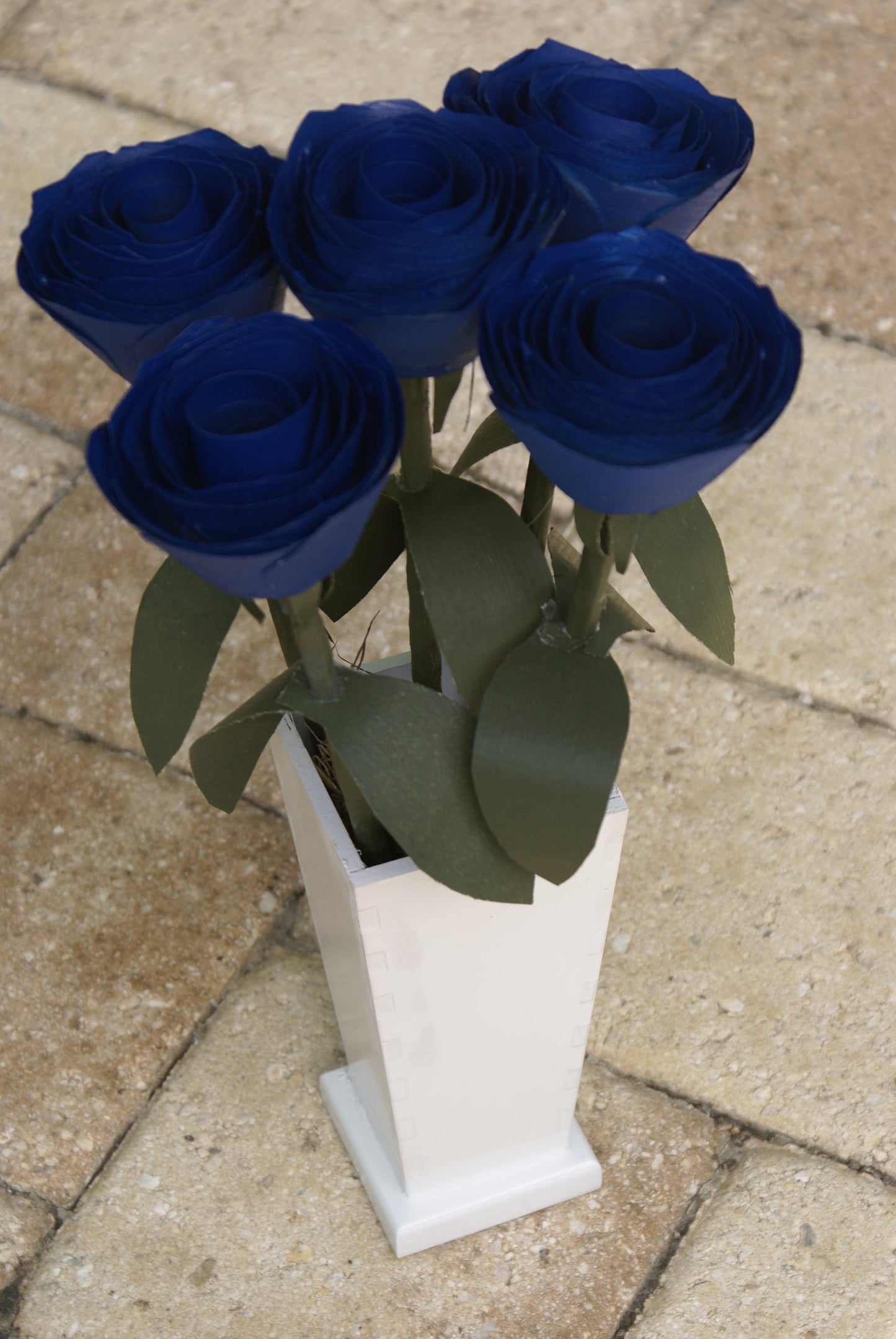 5 Blue wood roses in white vase, blue and white,