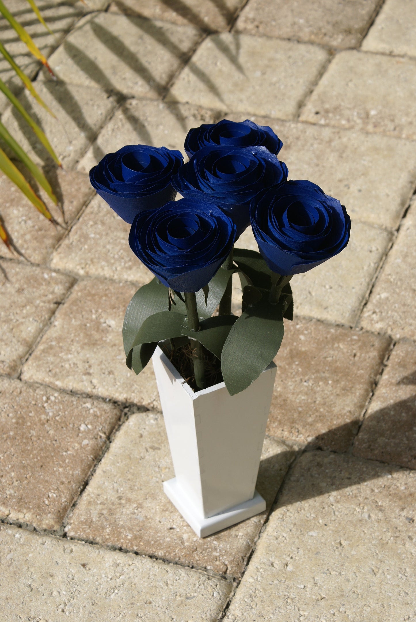 5 Blue wood roses in white vase, blue and white,