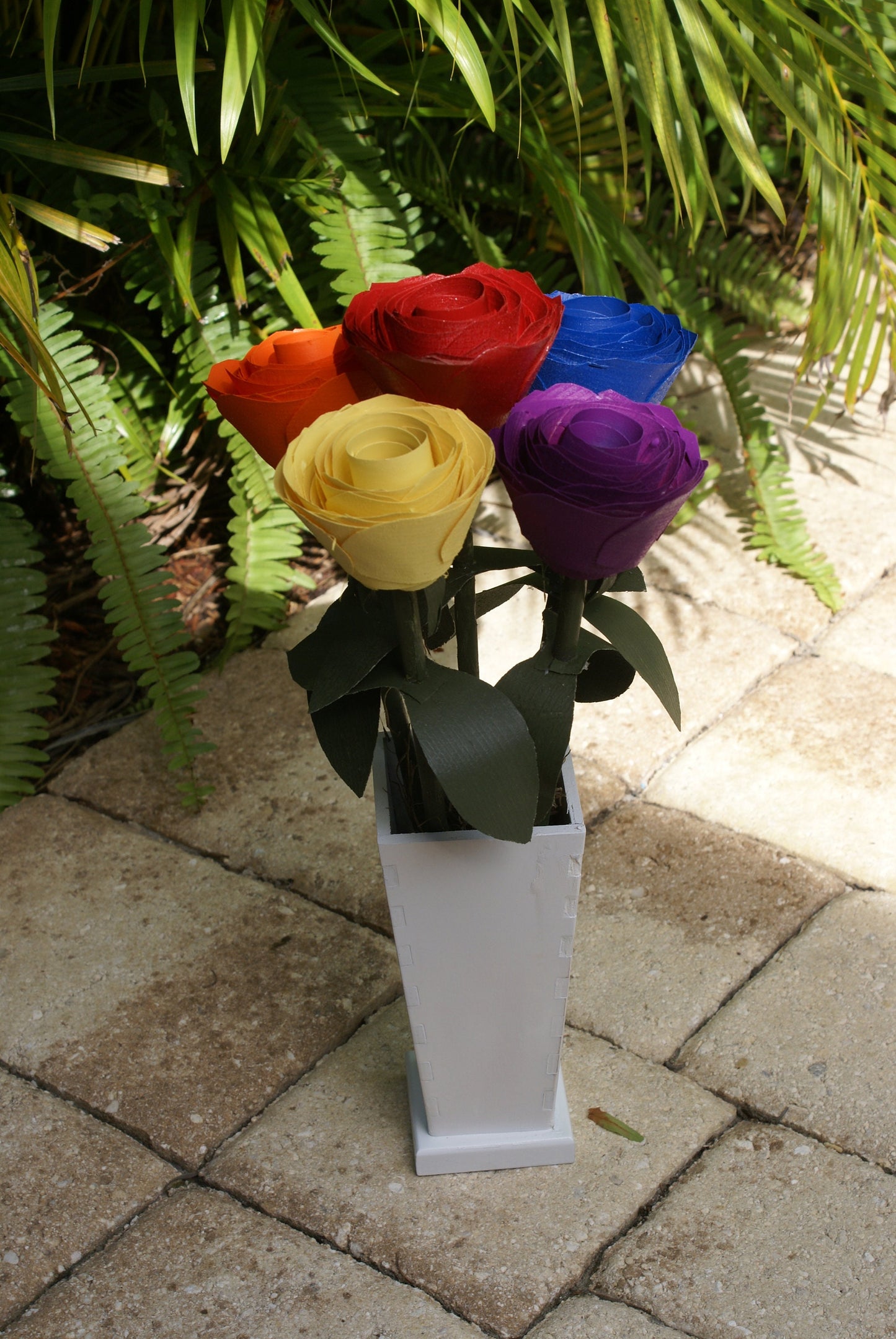 5 Rainbow color wood roses in white vase, Red, orange yellow blue and purple on green stems