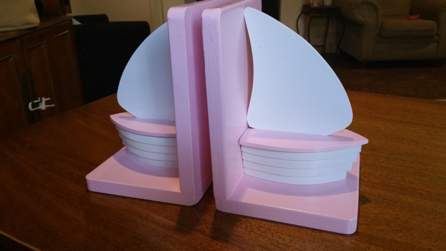 Pink and white wood sailboat bookends for nautical nursery