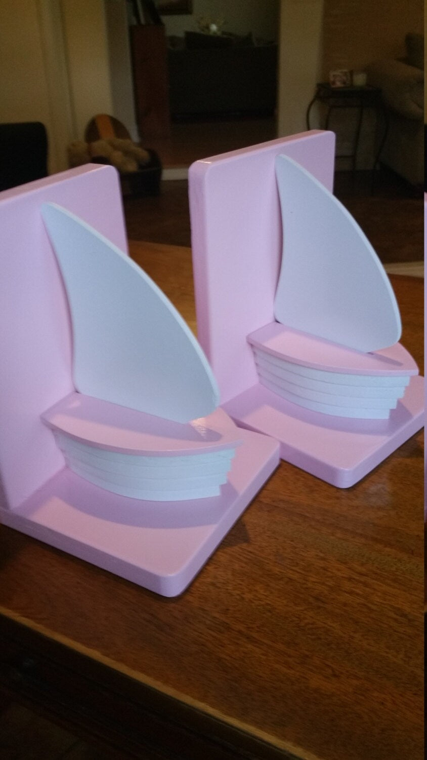 Pink and white wood sailboat bookends for nautical nursery