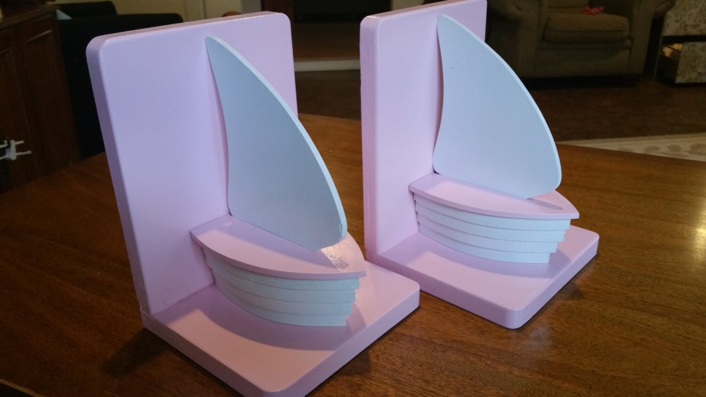 Pink and white wood sailboat bookends for nautical nursery